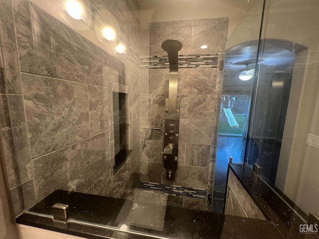 bathroom featuring tiled shower