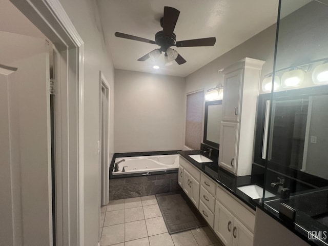 bathroom with tile patterned flooring, a sink, a ceiling fan, a whirlpool tub, and double vanity