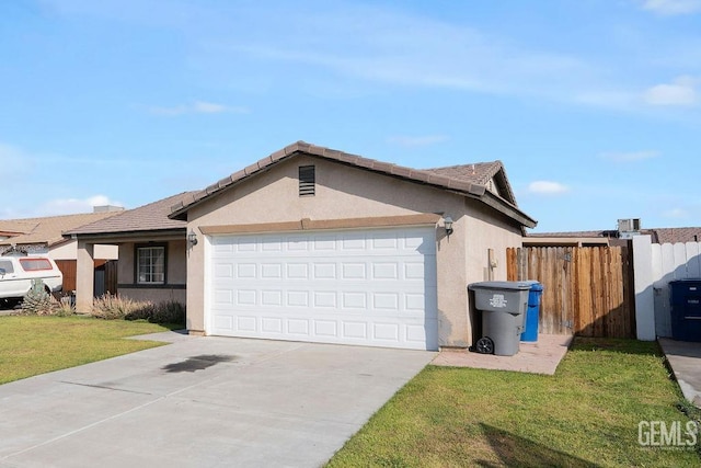 view of front of property featuring stucco siding, concrete driveway, an attached garage, a front yard, and fence