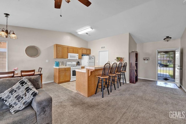 kitchen with light carpet, white appliances, a kitchen bar, and light countertops