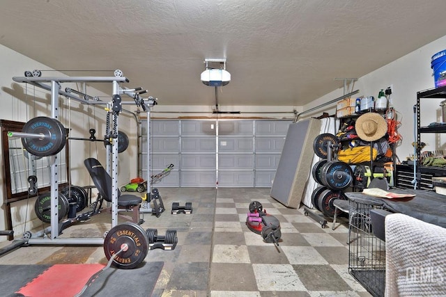 interior space with a garage and a textured ceiling