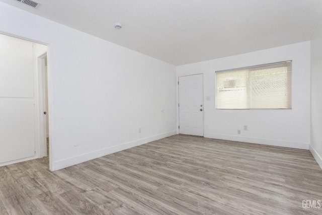 924 Day Ave, Bakersfield, CA 93308 - empty room featuring baseboards and light wood-type flooring