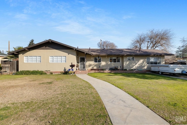 ranch-style house featuring a front lawn