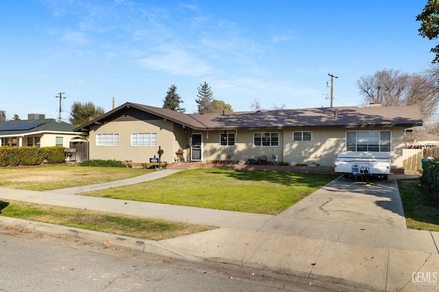 single story home featuring a front yard