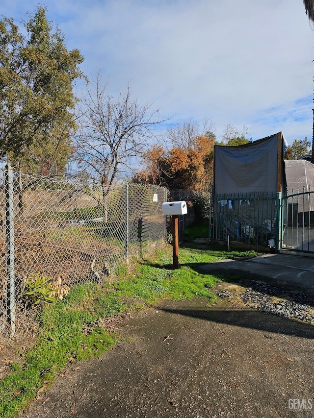2131 Berger St, Bakersfield, CA 93305 - rear view of house featuring stucco siding and a shingled roof