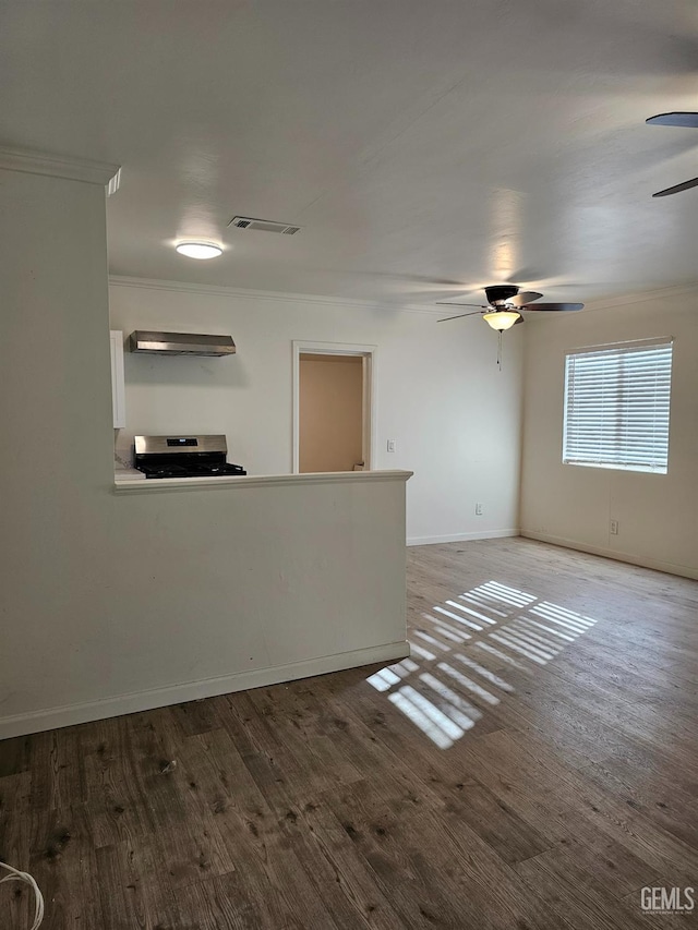 2131 Berger St, Bakersfield, CA 93305 - corridor featuring ornamental molding, wood finished floors, and baseboards