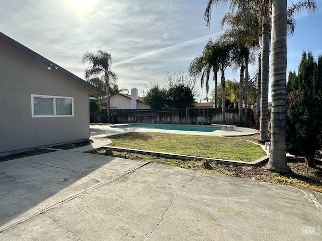 view of pool with a yard and a patio area