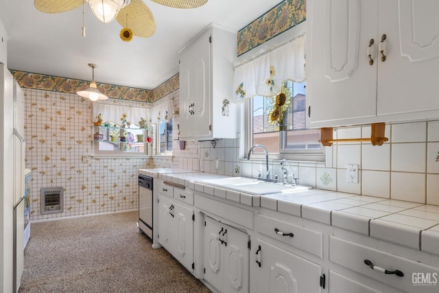 kitchen with tile counters and white cabinetry