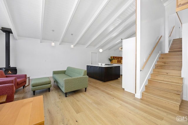 662 Woodland Ct, Arroyo Grande, CA 93420 - sitting room featuring light wood-style floors, stairs, and a wood stove