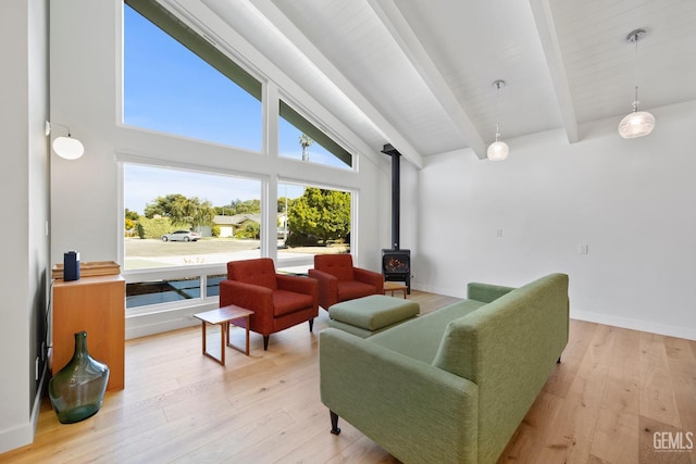 662 Woodland Ct, Arroyo Grande, CA 93420 - living room featuring a wood stove, beam ceiling, wood-type flooring, and high vaulted ceiling