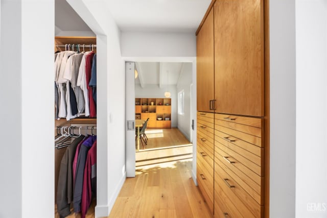 662 Woodland Ct, Arroyo Grande, CA 93420 - spacious closet with light wood-style floors and beamed ceiling