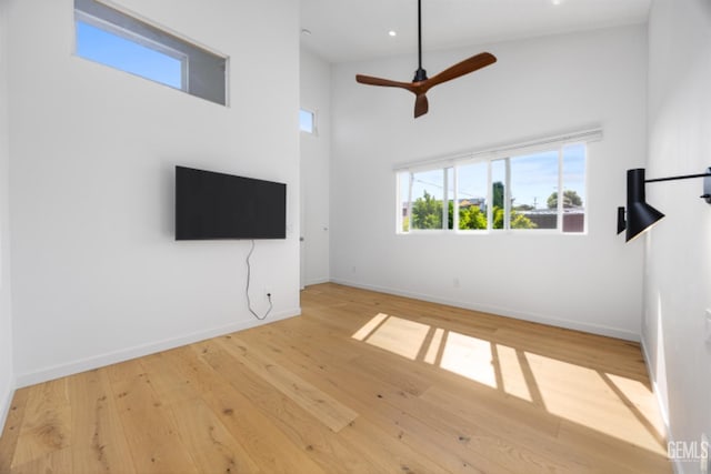 662 Woodland Ct, Arroyo Grande, CA 93420 - unfurnished living room with wood finished floors, a towering ceiling, ceiling fan, and recessed lighting