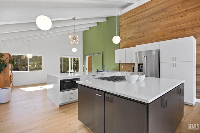 662 Woodland Ct, Arroyo Grande, CA 93420 - kitchen with beamed ceiling, high vaulted ceiling, white cabinets, light countertops, and appliances with stainless steel finishes