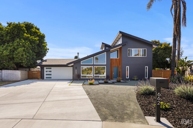662 Woodland Ct, Arroyo Grande, CA 93420 - contemporary house featuring concrete driveway and an attached garage