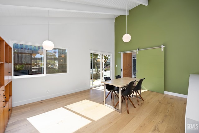 662 Woodland Ct, Arroyo Grande, CA 93420 - dining space featuring a barn door, wood finished floors, beamed ceiling, and high vaulted ceiling