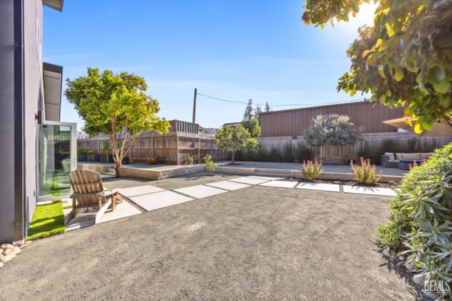 662 Woodland Ct, Arroyo Grande, CA 93420 - fenced backyard with a patio area and outdoor lounge area