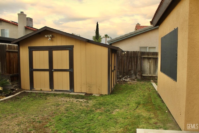 view of shed featuring a fenced backyard