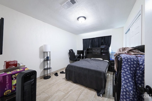 bedroom with a textured ceiling