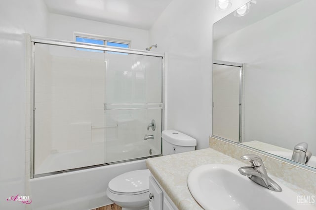full bath with vanity and combined bath / shower with glass door