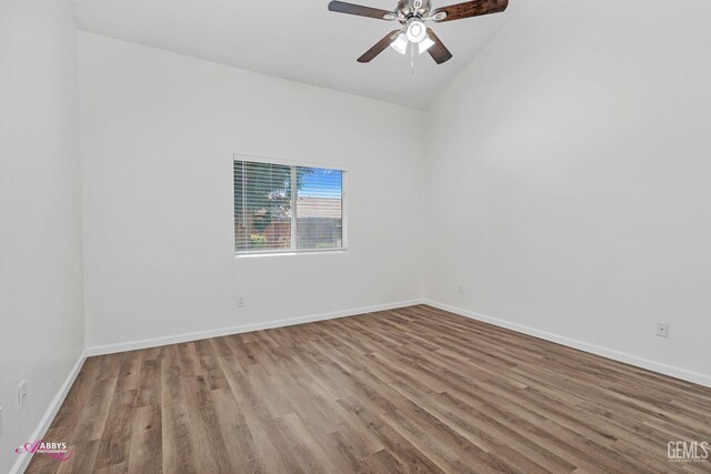spare room featuring wood finished floors and a ceiling fan