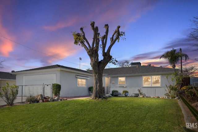 ranch-style home featuring a yard