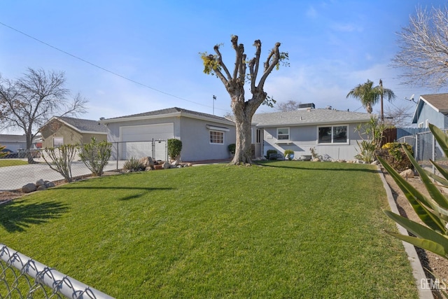 view of front of home with a garage and a front lawn