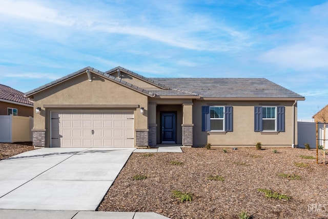 4920 Tachi Ave, Bakersfield, CA 93306 - view of front of home featuring stucco siding, a garage, and concrete driveway