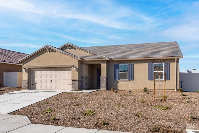 4920 Tachi Ave, Bakersfield, CA 93306 - view of front of house with stucco siding, a garage, and driveway