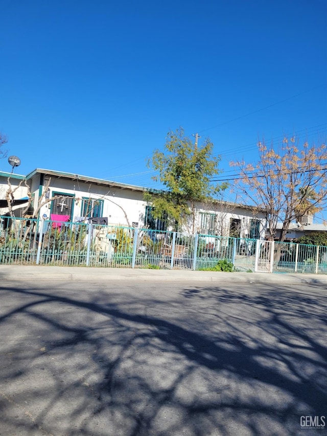 view of building exterior featuring fence