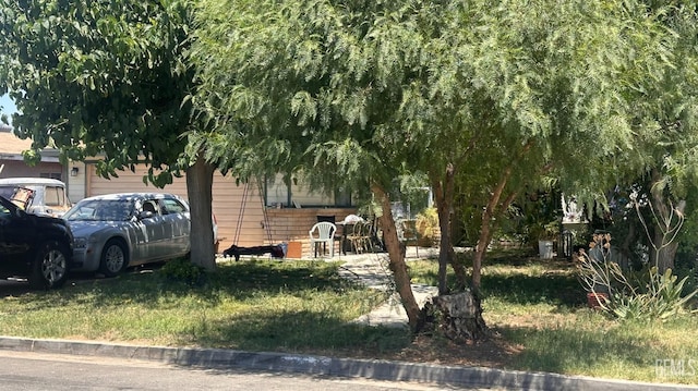 9817 San Diego St, Lamont, CA 93241 - view of front of home featuring a garage and a front yard