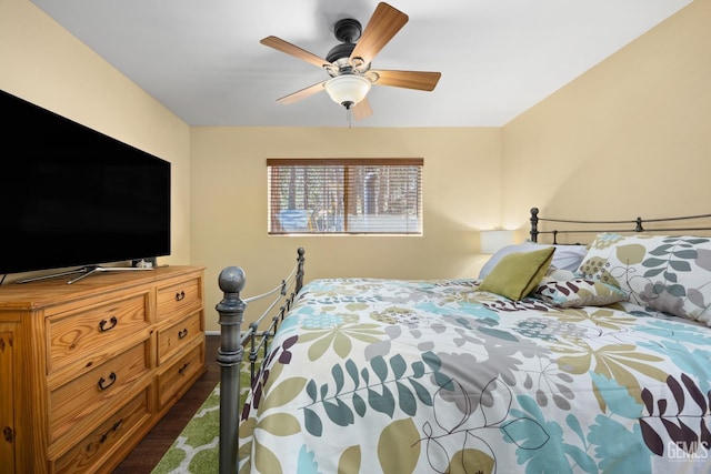 bedroom featuring dark wood-type flooring and ceiling fan
