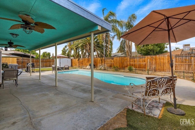 view of pool with a storage unit, ceiling fan, a patio area, and a grill