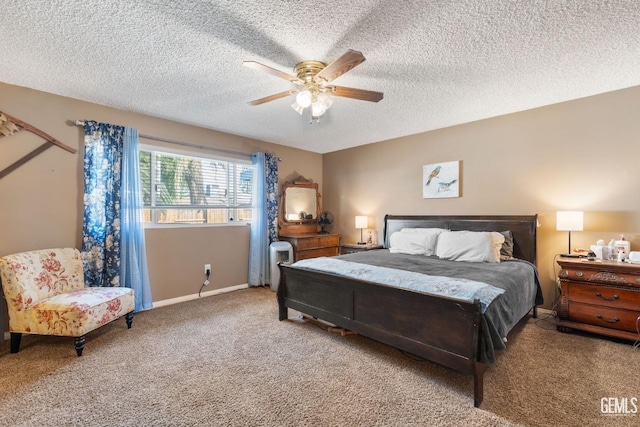 bedroom featuring carpet flooring, ceiling fan, and a textured ceiling