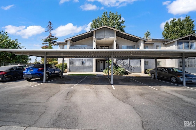 view of parking / parking lot featuring a carport