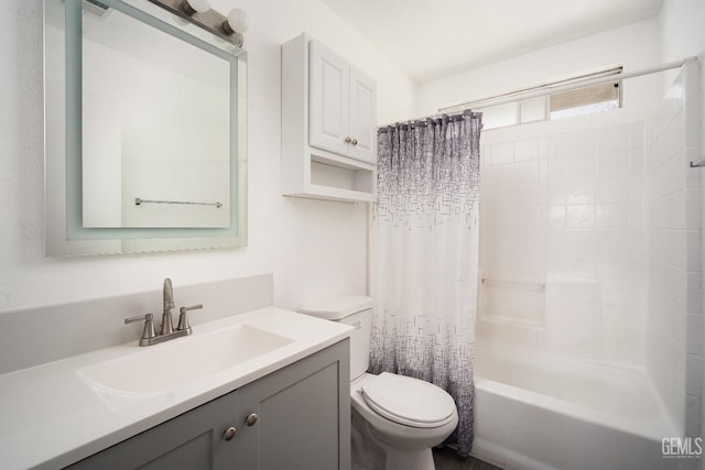 full bathroom with toilet, shower / bathtub combination with curtain, and vanity