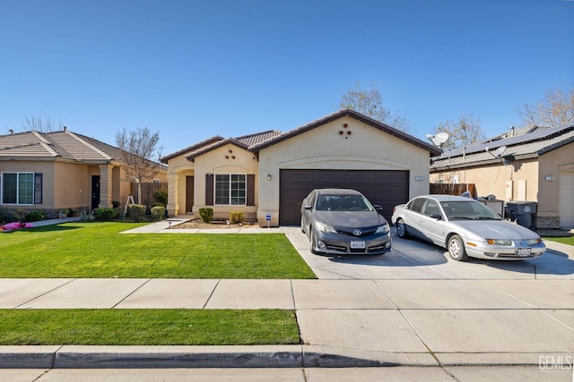 view of front facade with a garage and a front lawn