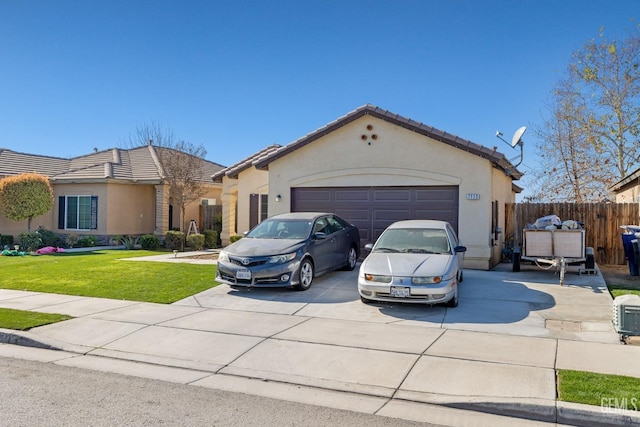 view of front of home with a front lawn and a garage