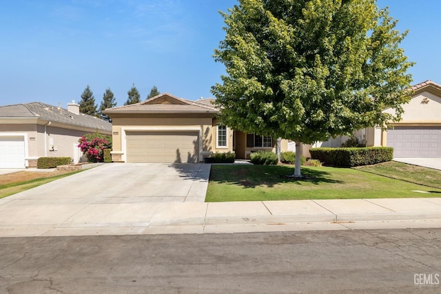 view of front of house featuring a garage and a front lawn