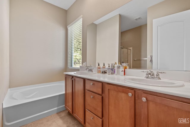 bathroom featuring tile patterned floors, separate shower and tub, and vanity