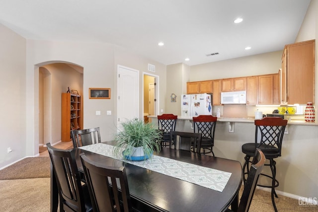 view of carpeted dining area