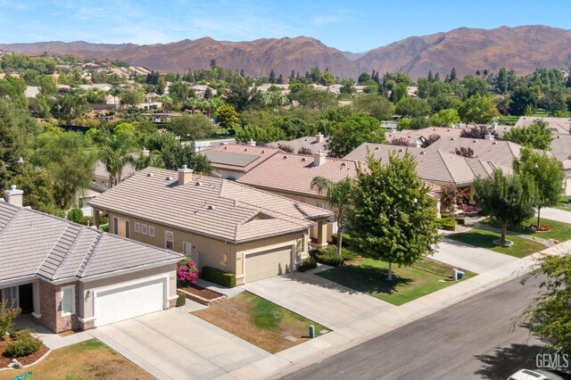 birds eye view of property featuring a mountain view