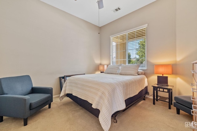 bedroom featuring light colored carpet and ceiling fan