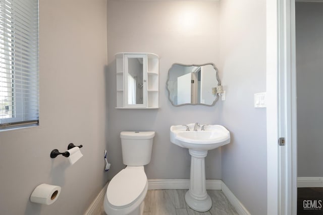 2200 Park Way, Bakersfield, CA 93304 - bathroom with toilet, marble finish floors, baseboards, and a sink