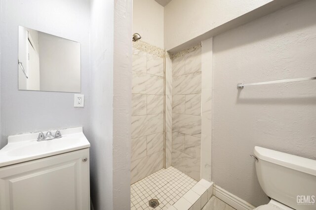 2200 Park Way, Bakersfield, CA 93304 - bathroom featuring a stall shower, vanity, and toilet
