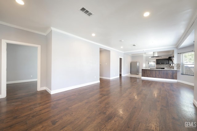 2200 Park Way, Bakersfield, CA 93304 - unfurnished living room with dark wood-type flooring, recessed lighting, crown molding, and baseboards