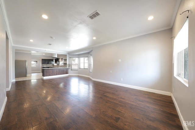 2200 Park Way, Bakersfield, CA 93304 - unfurnished living room with dark wood-style flooring, recessed lighting, baseboards, and crown molding