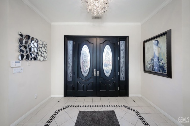 foyer entrance with an inviting chandelier, light tile patterned floors, and ornamental molding