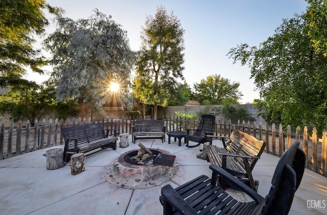 view of patio with a fire pit