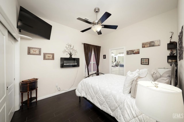 bedroom with ensuite bathroom and ceiling fan