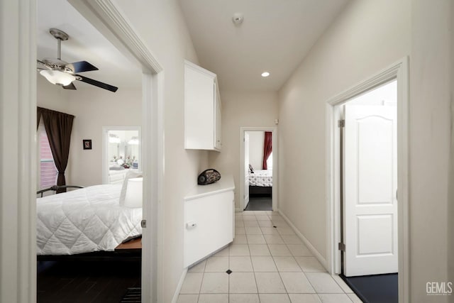 hall featuring light tile patterned floors